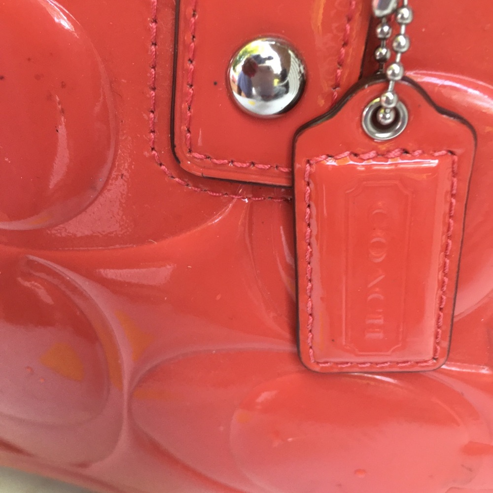 Nice Coach patent leather purse.  Orange.